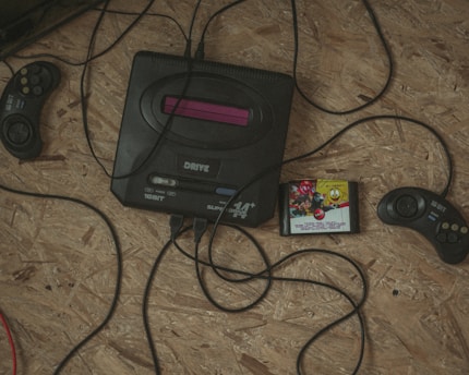 a video game system sitting on top of a wooden floor