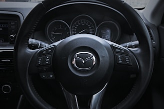 a steering wheel and dashboard of a car