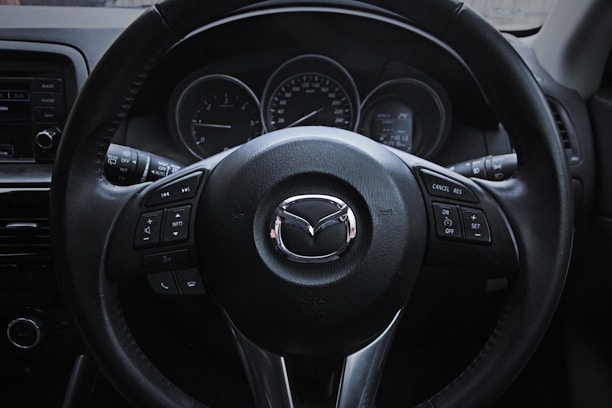 a steering wheel and dashboard of a car