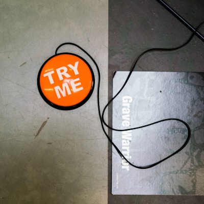 a picture of a tag that says try me on it
