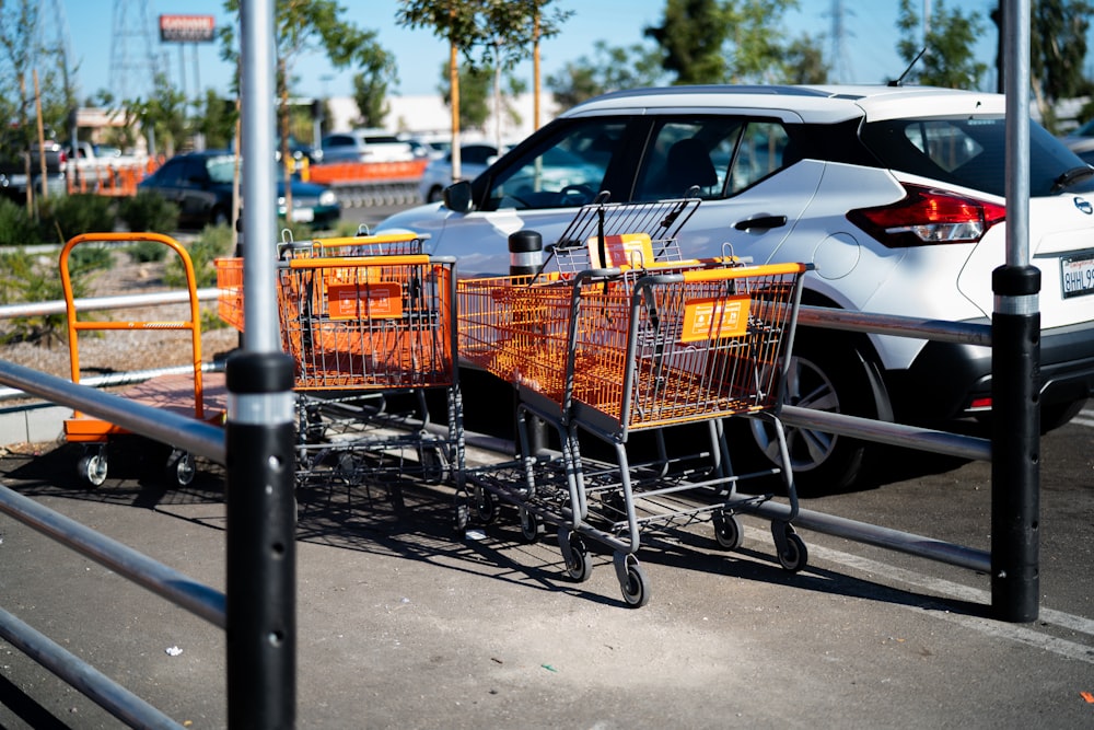 a couple of shopping carts sitting in a parking lot