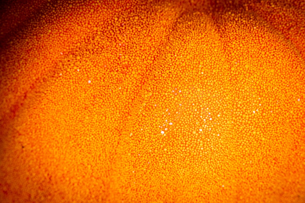 a close up of an orange with a black background