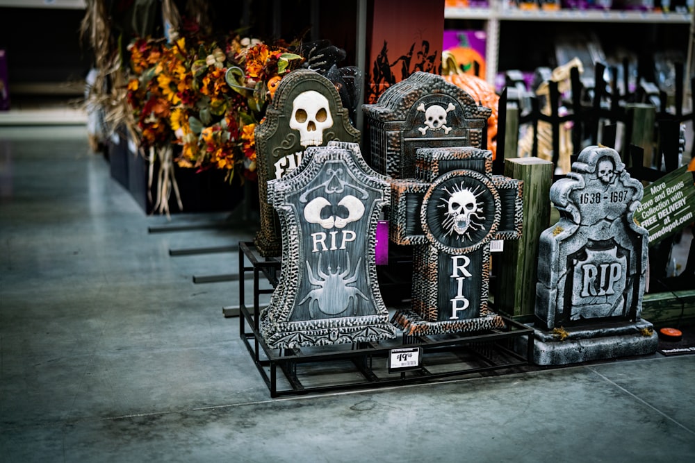 a row of halloween tombstones with skulls on them