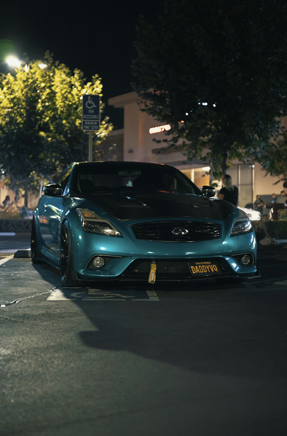 a blue car parked on the side of the road