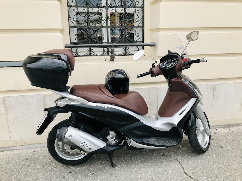 a motor scooter parked on the side of the street