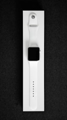 A sleek, modern wearable device designed for enhancing physical mobility, shown on a black and white background