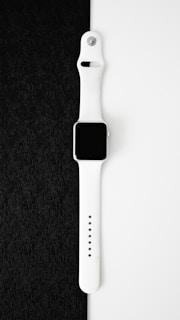 an apple watch series 10 sitting on top of a black cloth