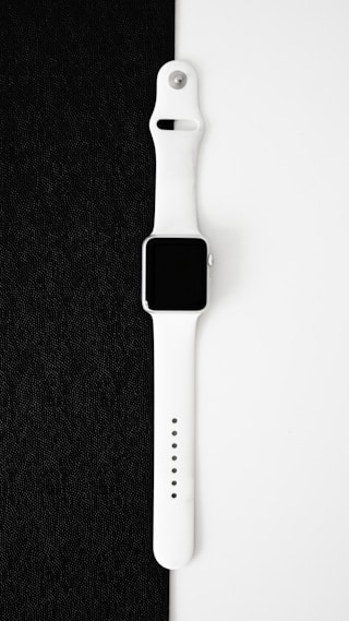an apple watch series 10 sitting on top of a black cloth
