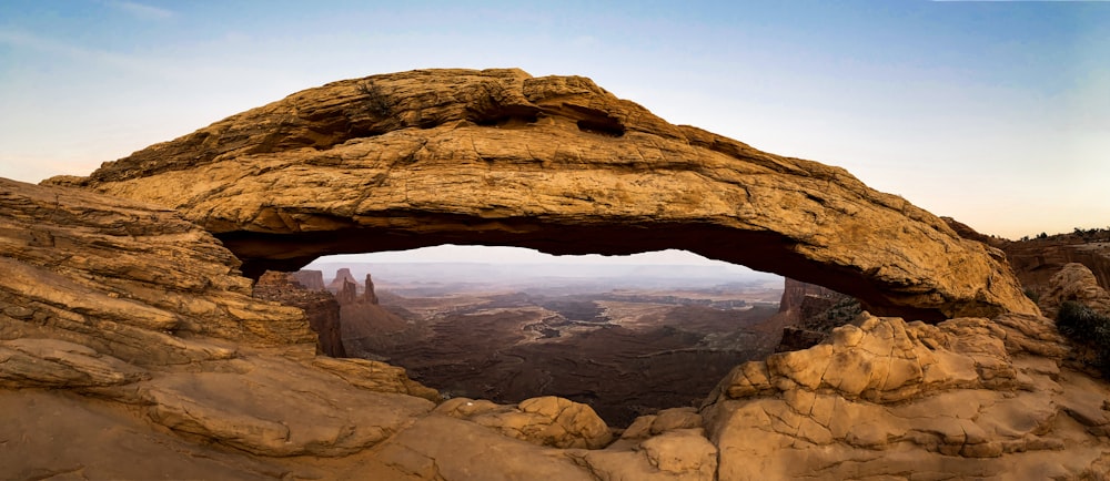 a rock formation with a hole in the middle of it