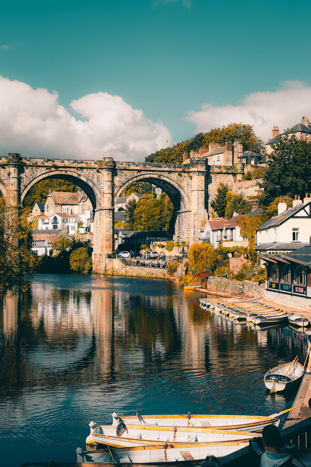 a bridge over a body of water with boats in it