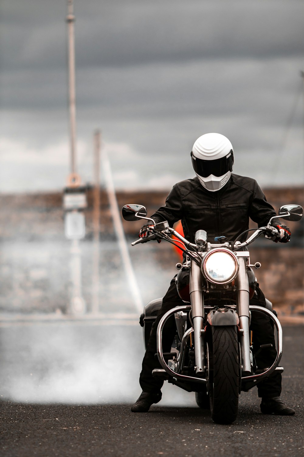 a person riding a motorcycle on a road