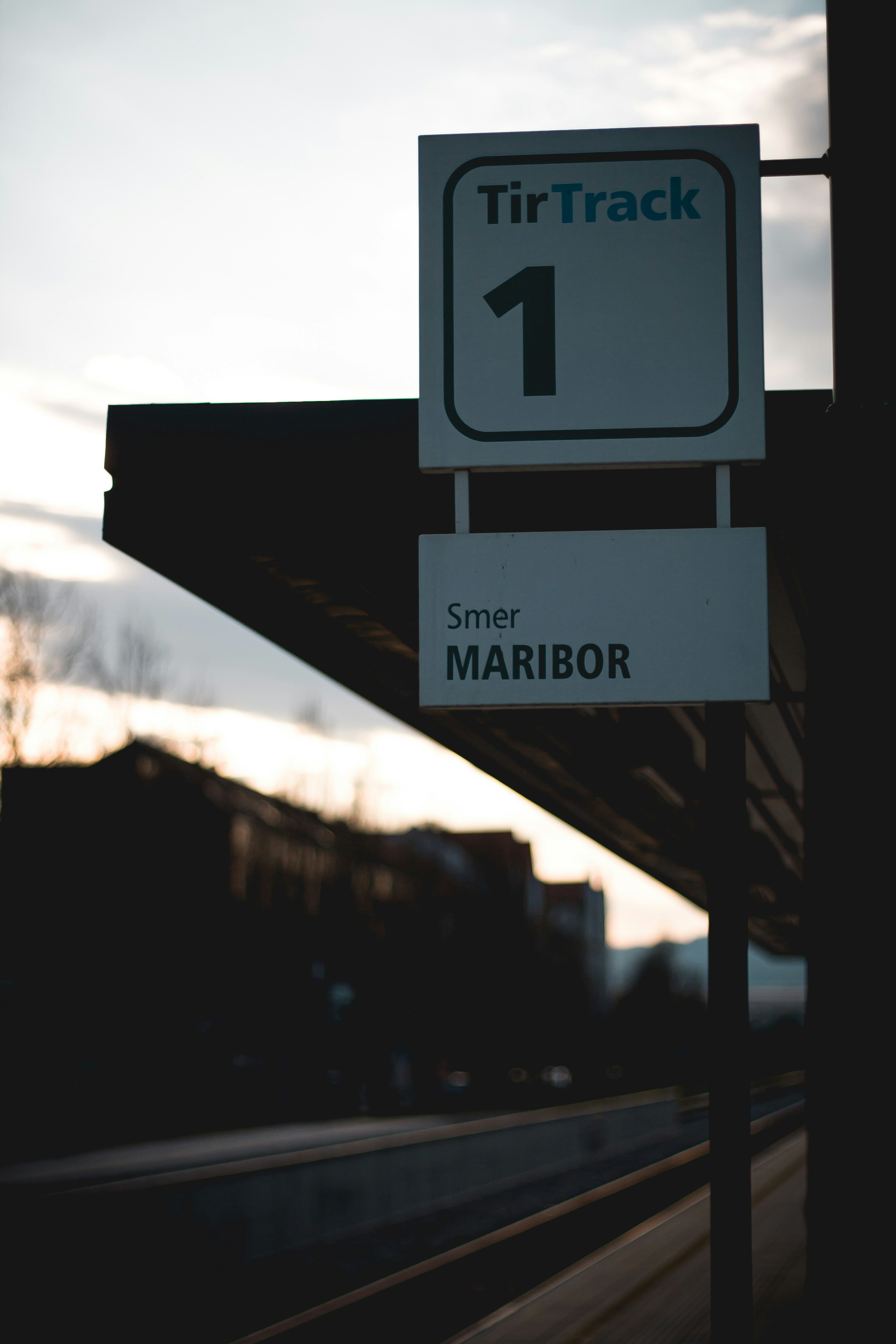 A train track sign next to a train track photo – Free Sunset Image on ...