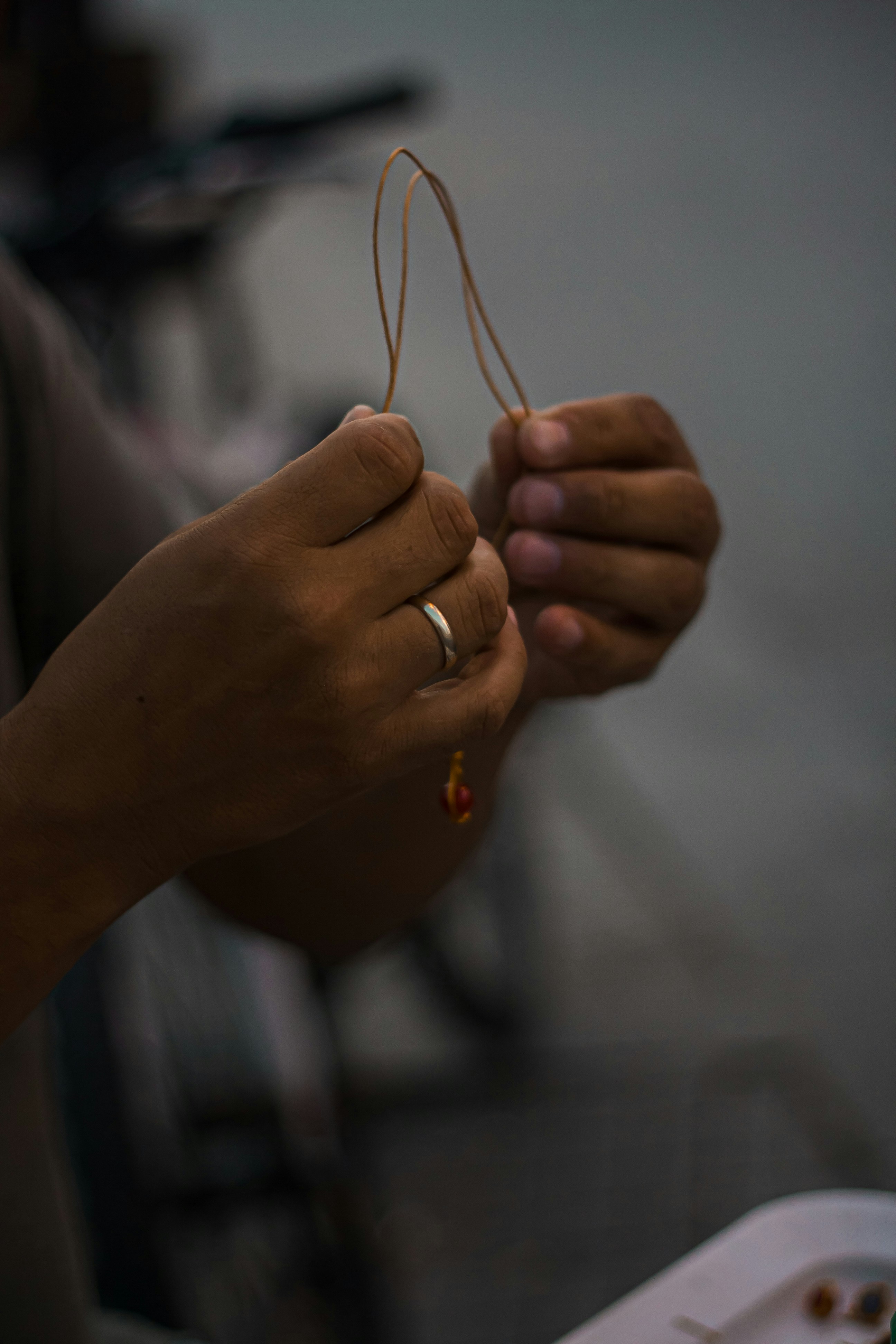 a person holding a pair of scissors in their hand