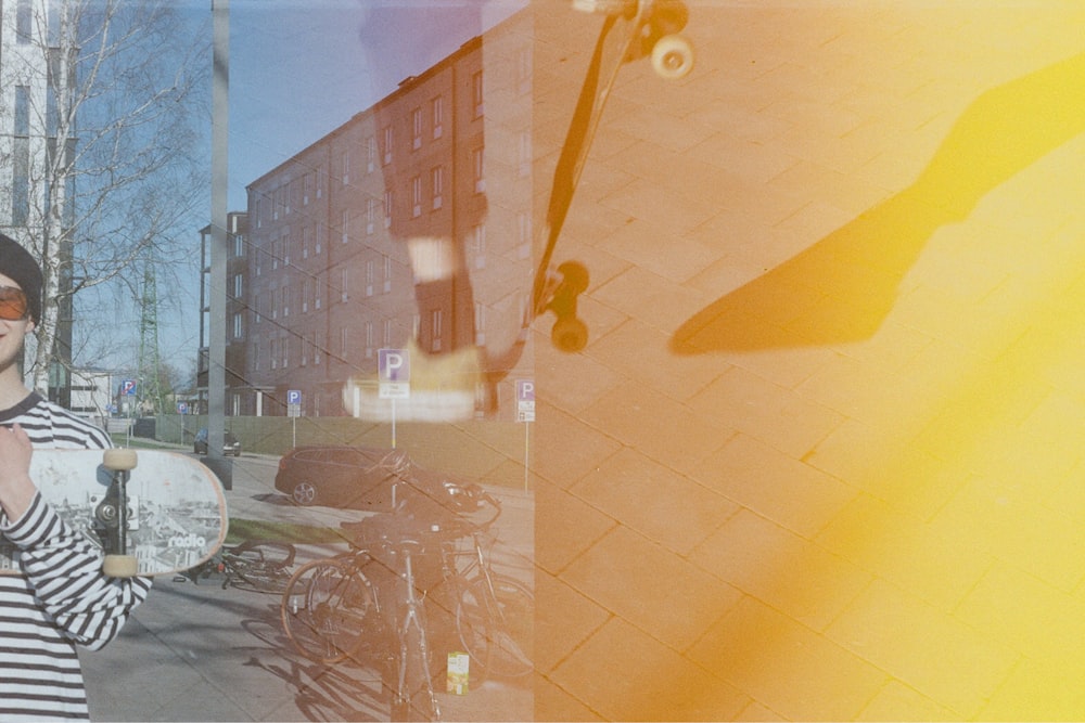 a woman in striped shirt holding a skateboard