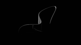 A sleek product design featuring minimalist lines and a subtle glow, set against a dark background.