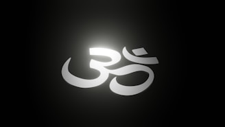 A glowing, abstract cloud symbol intertwined with a radiant Om symbol, representing AI energy.