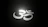 Close-up of glowing chakra symbols softly illuminated on a dark background.