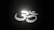 Close-up of glowing chakra symbols softly illuminated on a dark background.