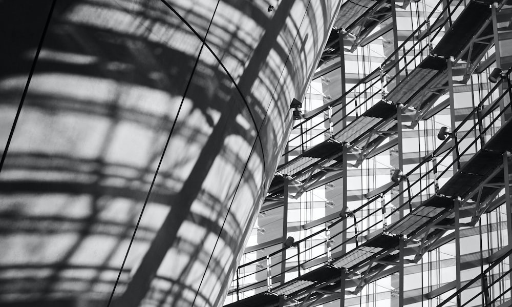 a black and white photo of a building with lots of windows