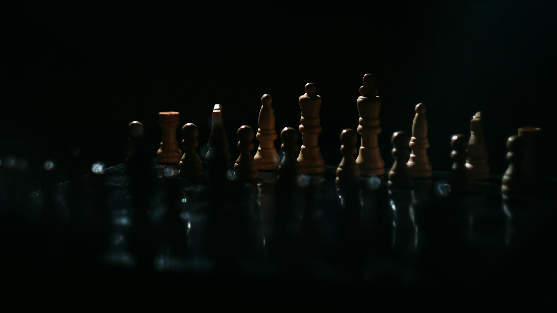 a group of chess pieces sitting on top of a table
