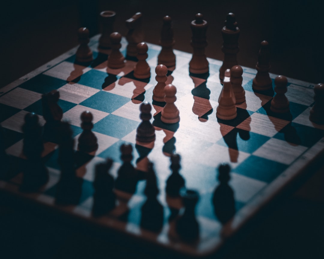a chess board with a lot of chess pieces on it, Chess