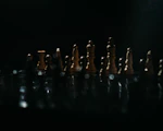 a group of chess pieces sitting on top of a table