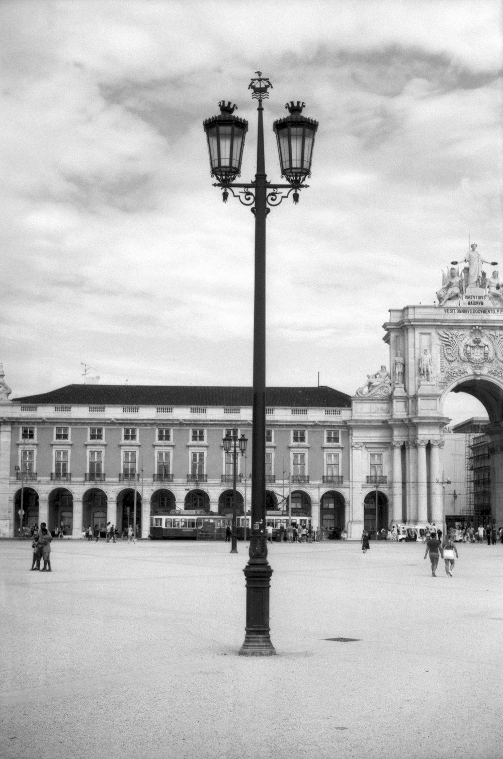 a black and white photo of a city square