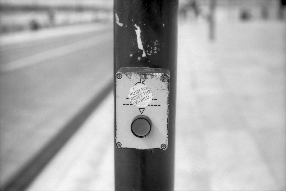 a black and white photo of a parking meter