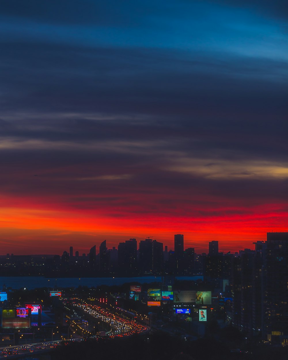 a view of a city skyline at sunset