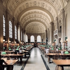 a large room filled with lots of tables and chairs