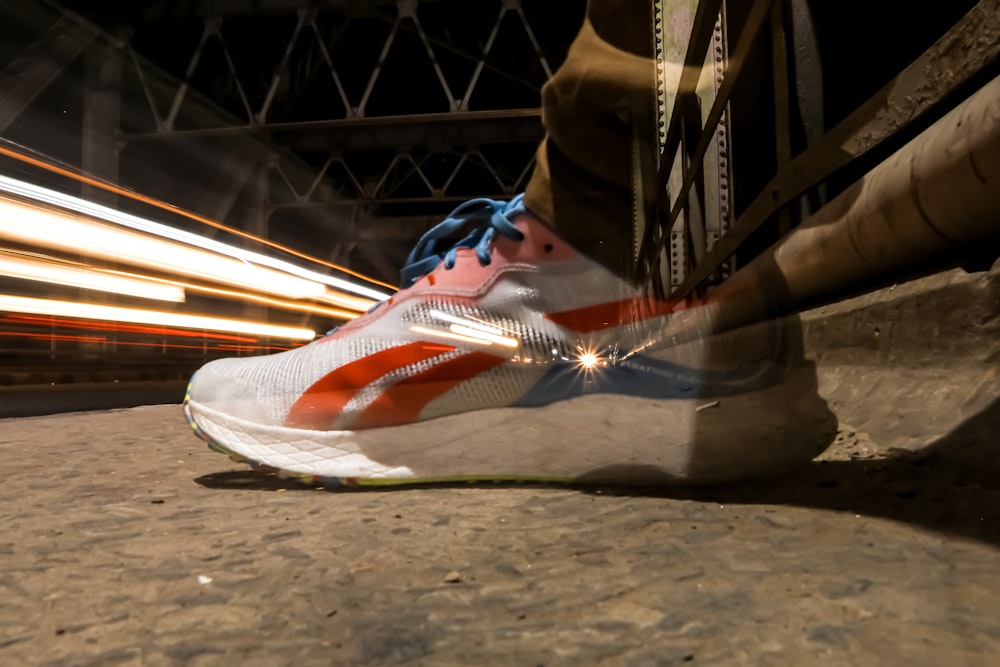 a pair of running shoes with motion blurs in the background