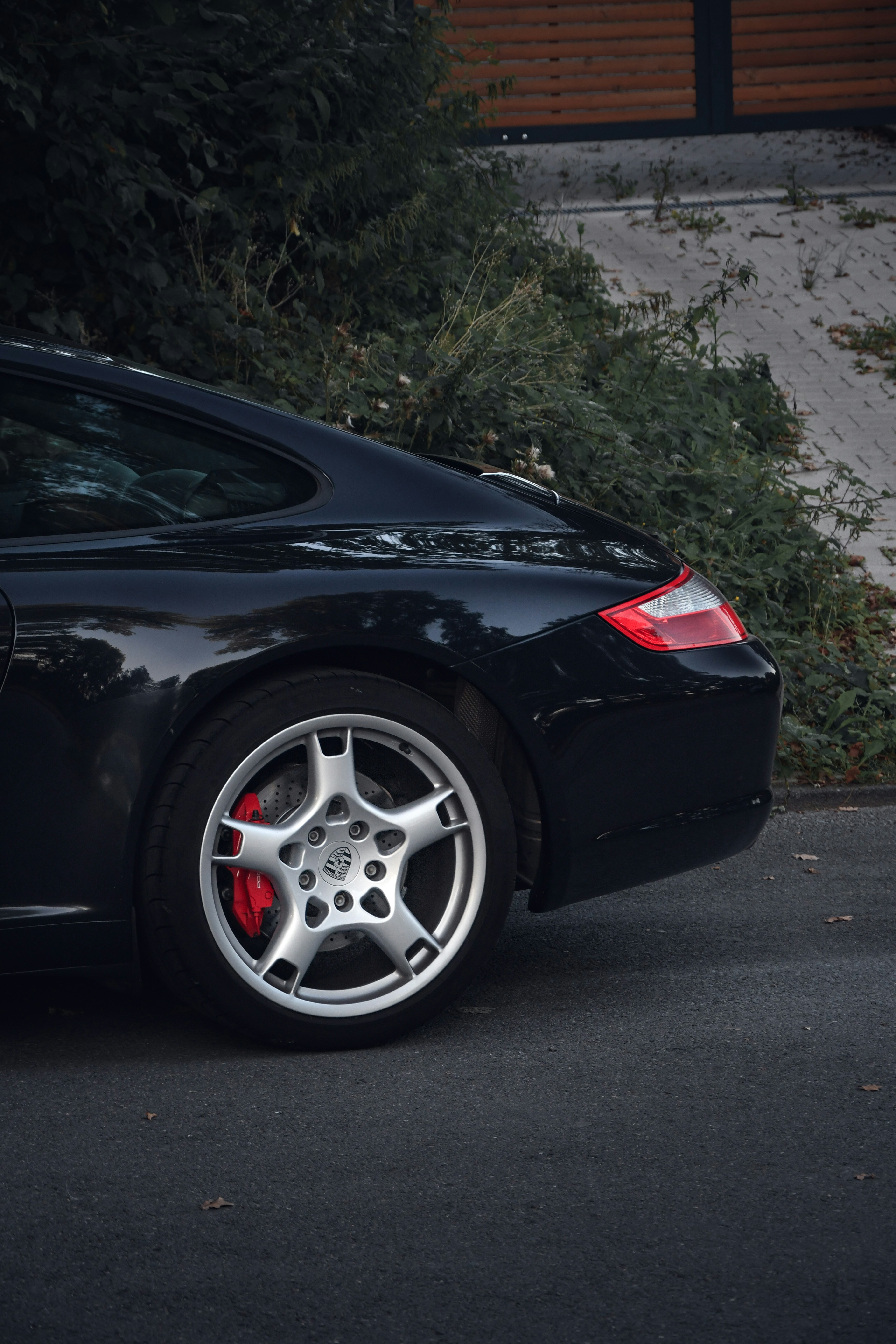 a black sports car parked on the side of the road