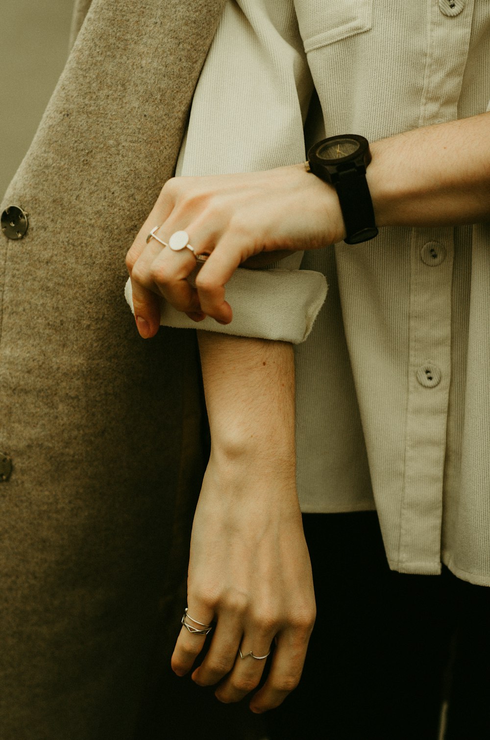 a close up of a person holding the hand of another person