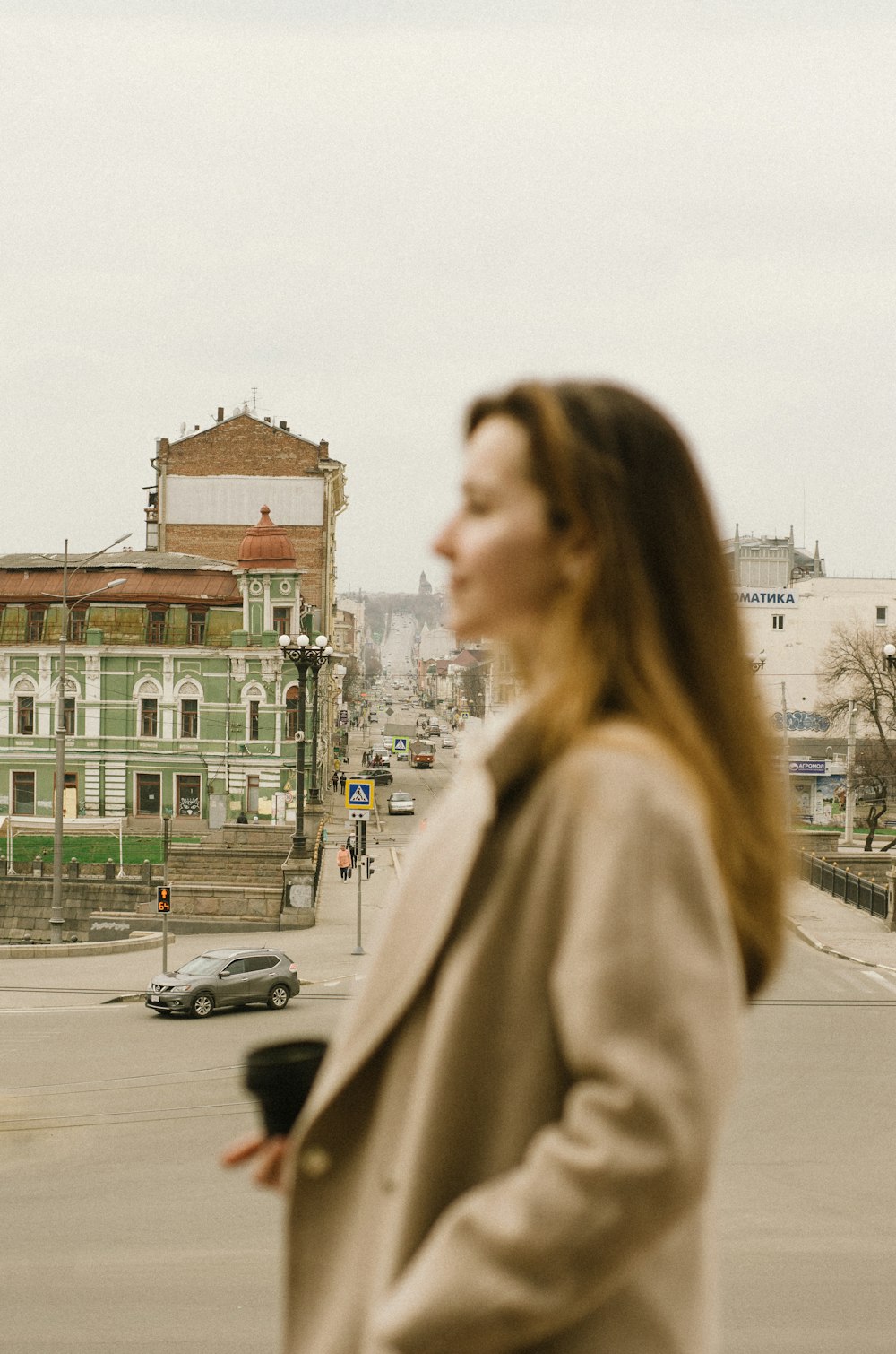 a woman standing in the middle of a street