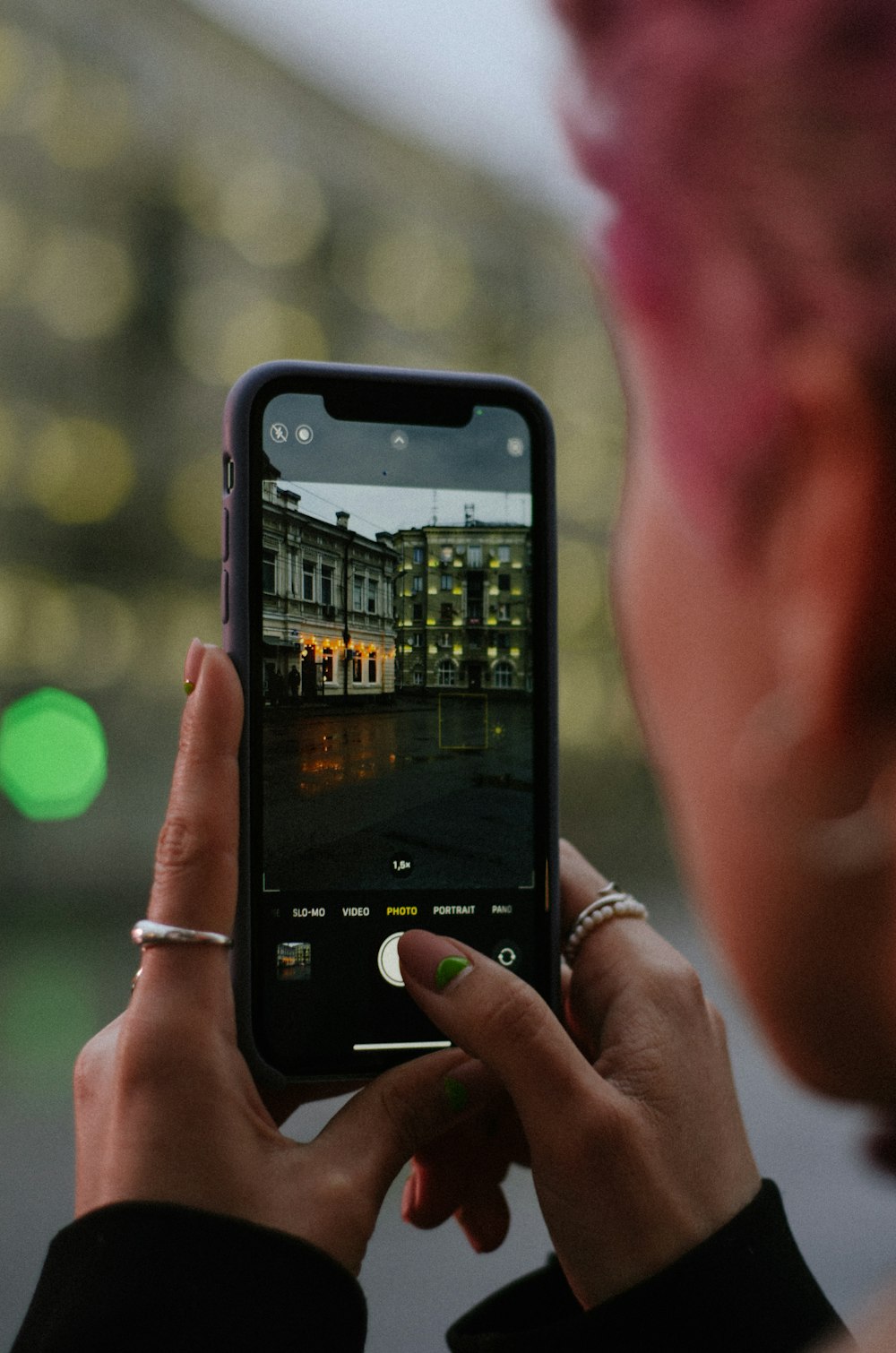 a woman taking a picture with her cell phone