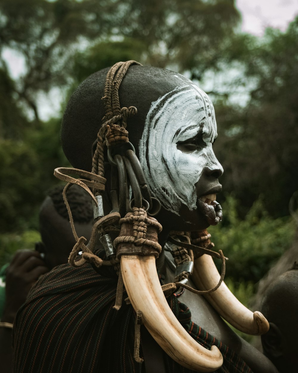 a man with a mask and horns on his head