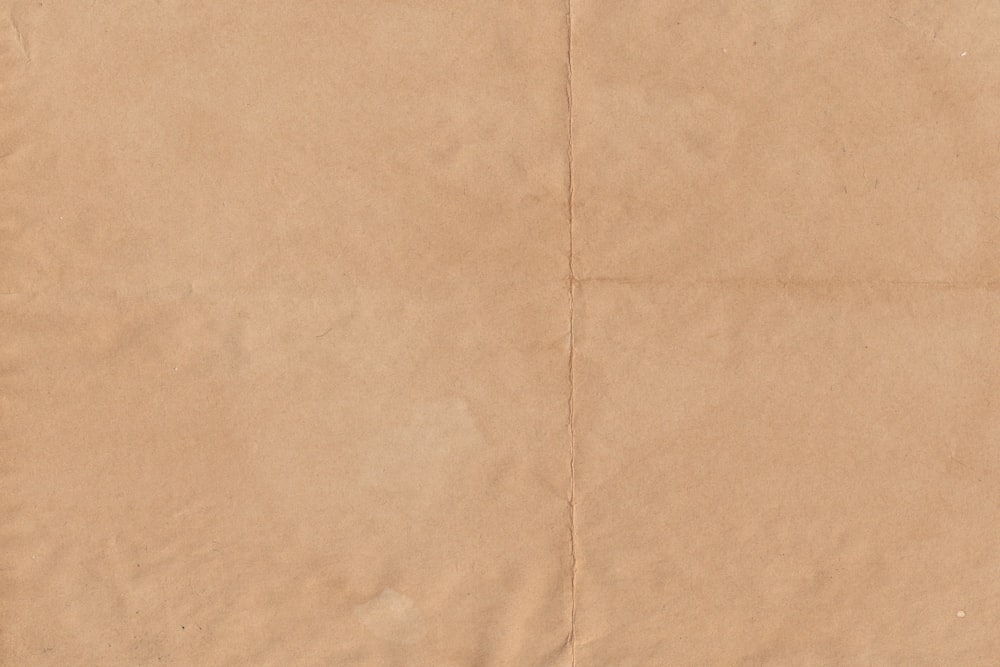 a piece of brown paper that has been folded