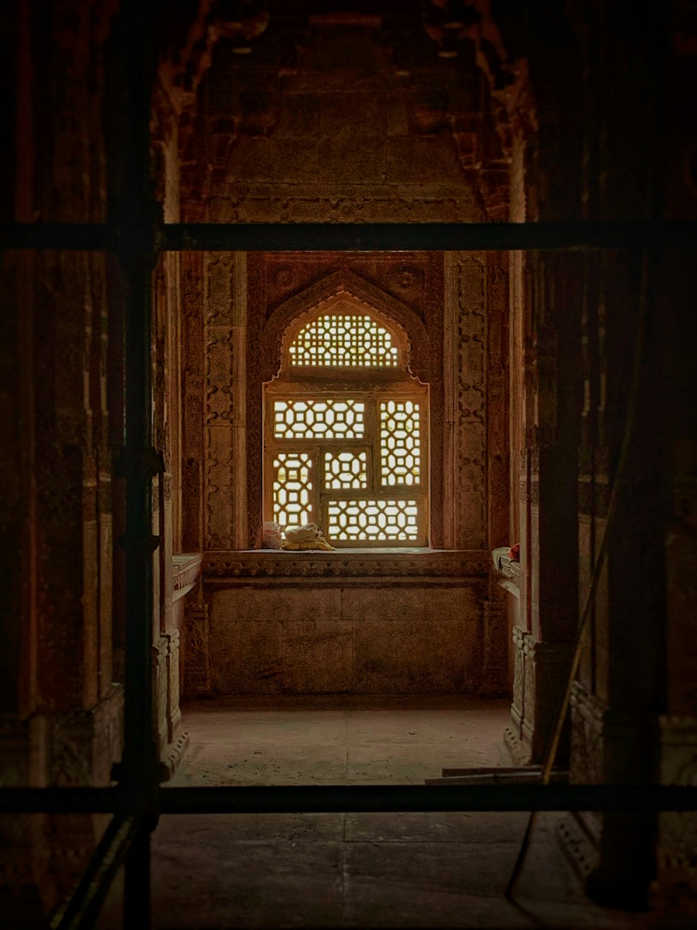 a window in an old building with a wooden frame