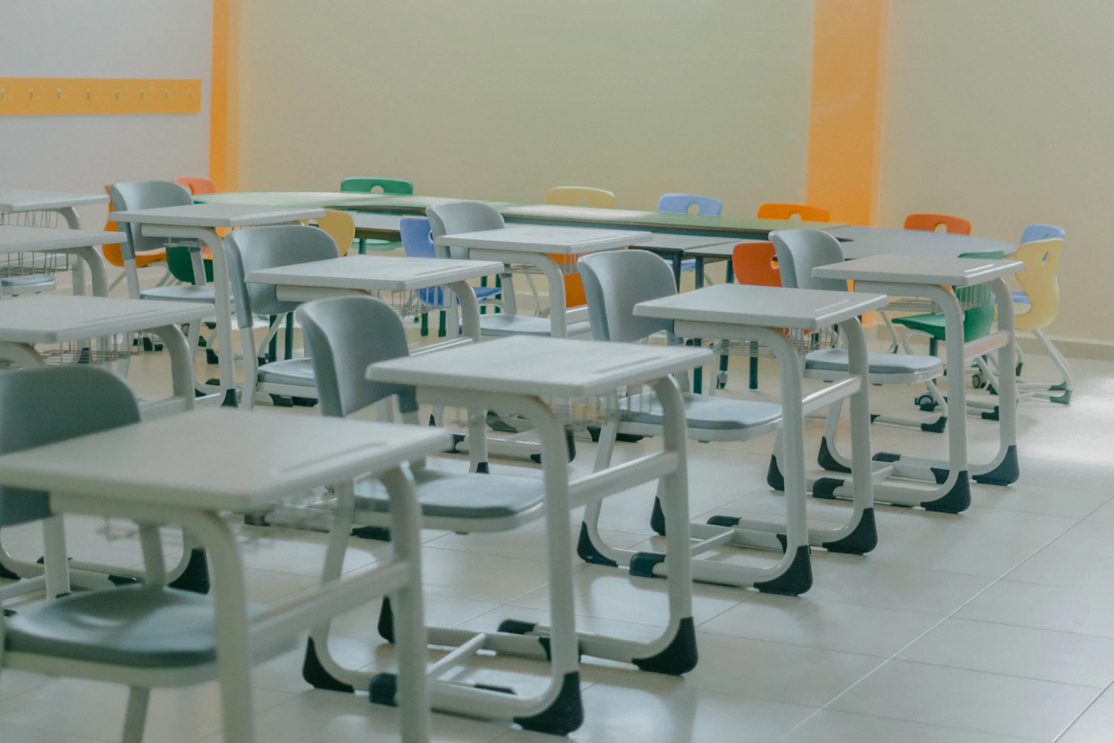 Rows of desks in an empty classroom
