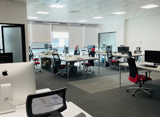 A modern office space with gleaming floors and organized desks.