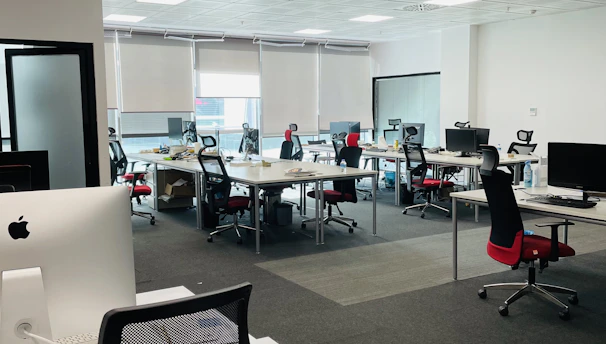 A modern office space with gleaming floors and organized desks.