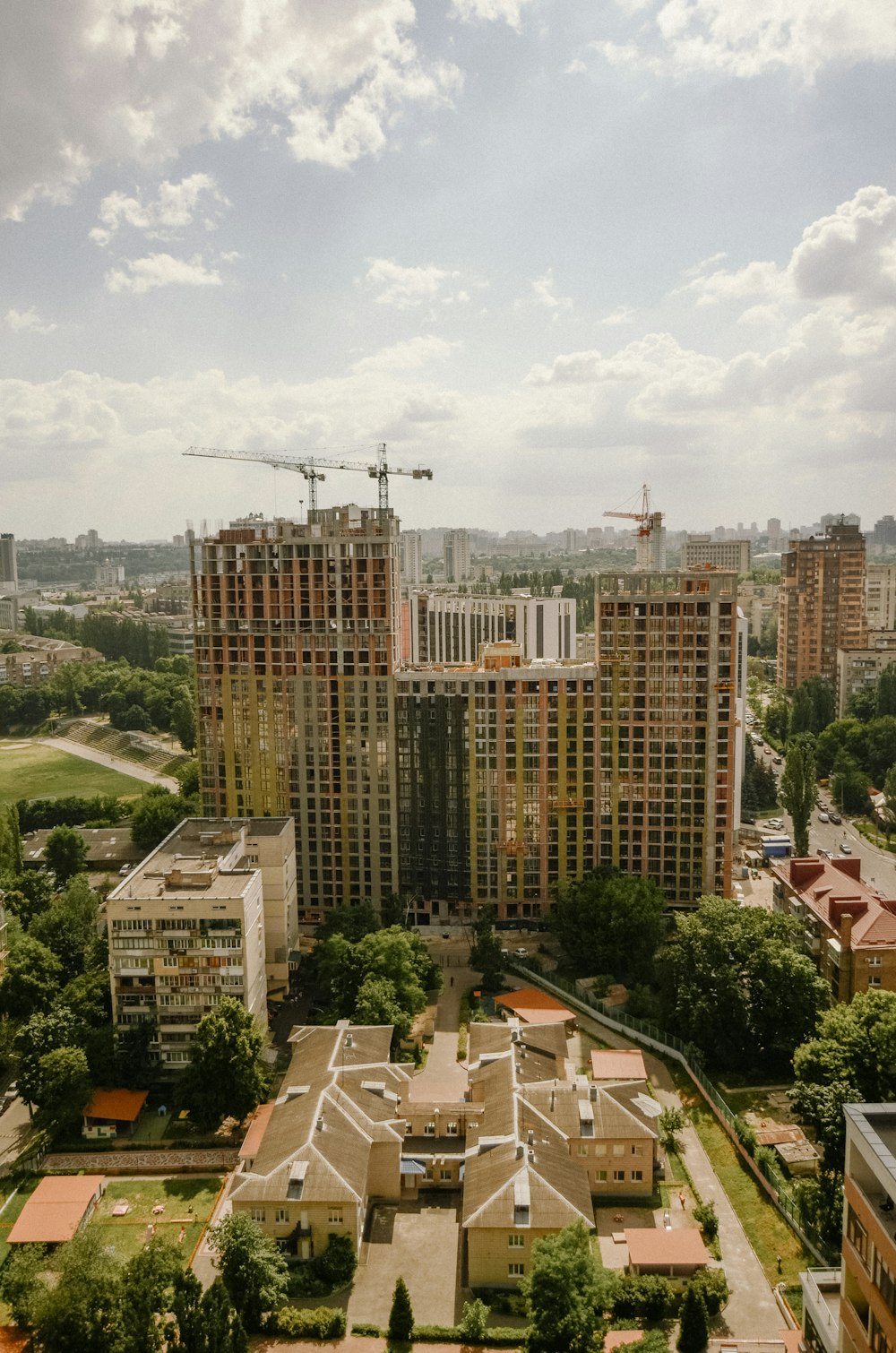 a city with a lot of tall buildings under construction