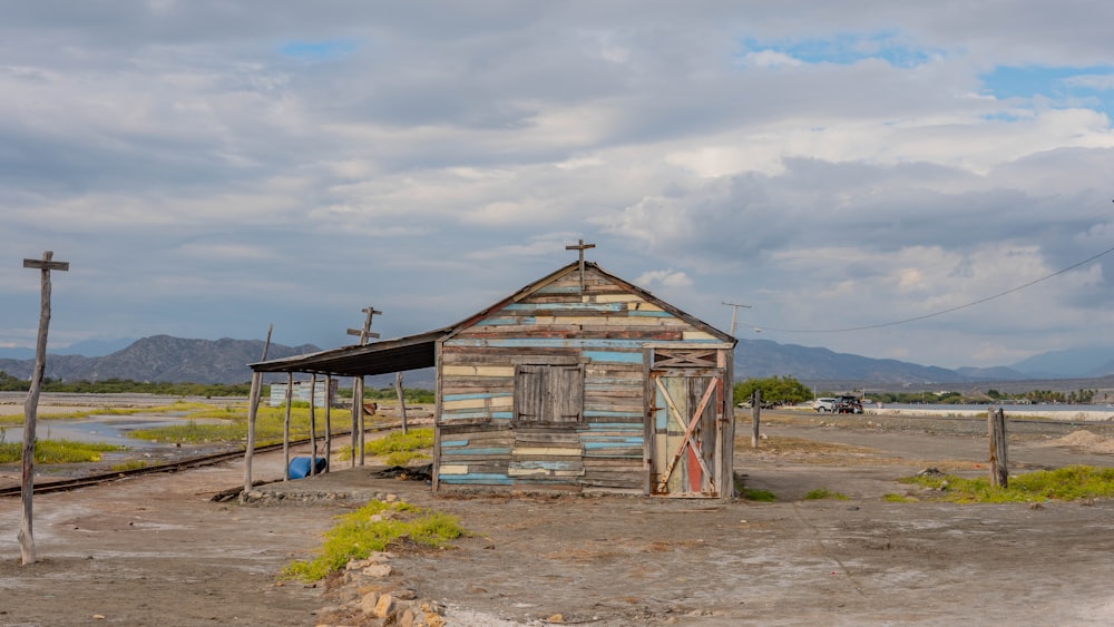 an old shack sits in the middle of nowhere