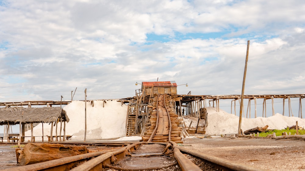 a train track with a building in the background