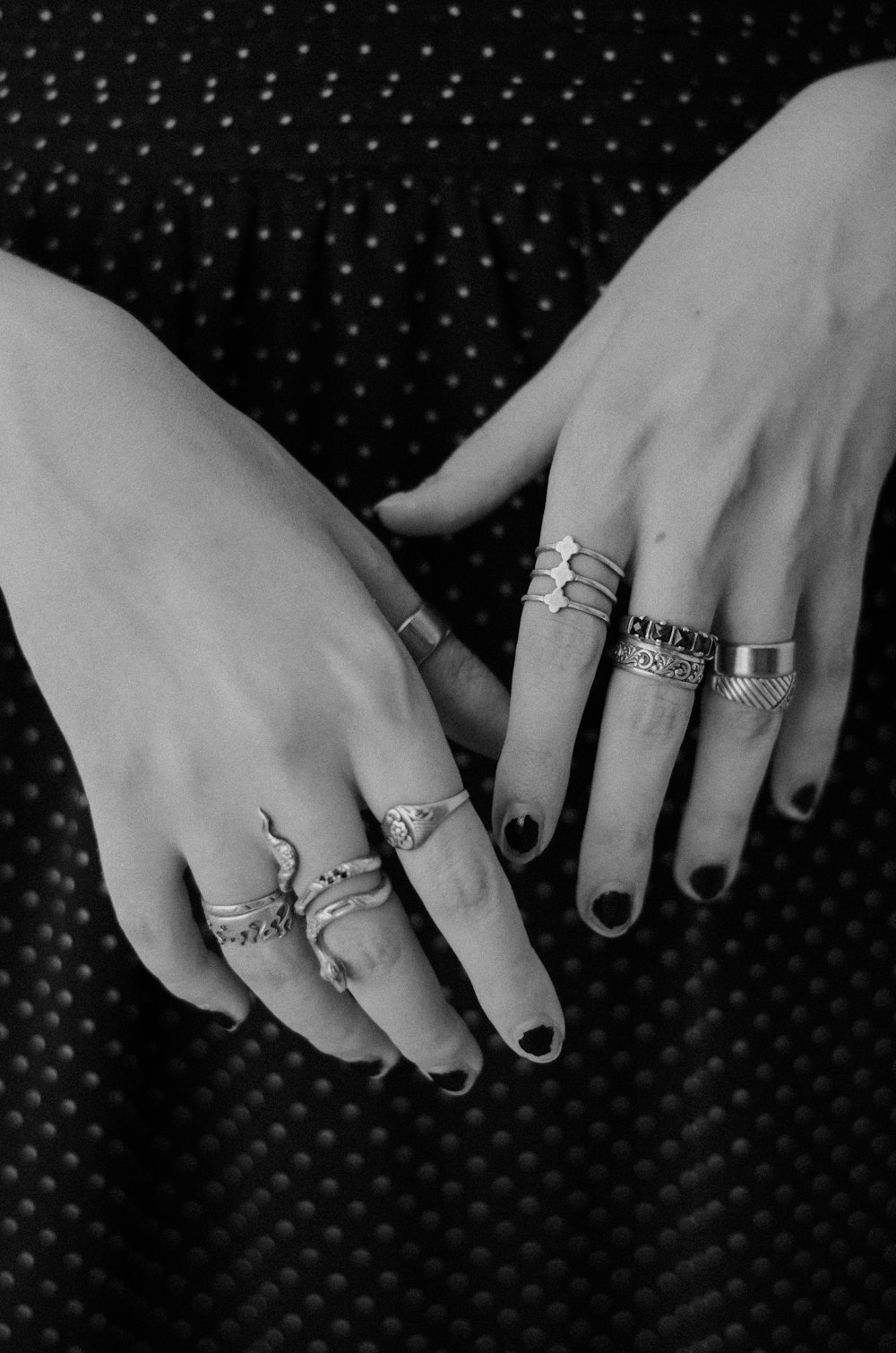 a woman's hands with rings on them