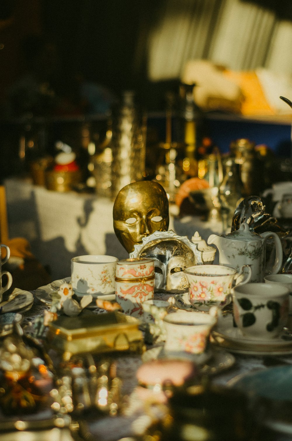 a table topped with lots of cups and saucers