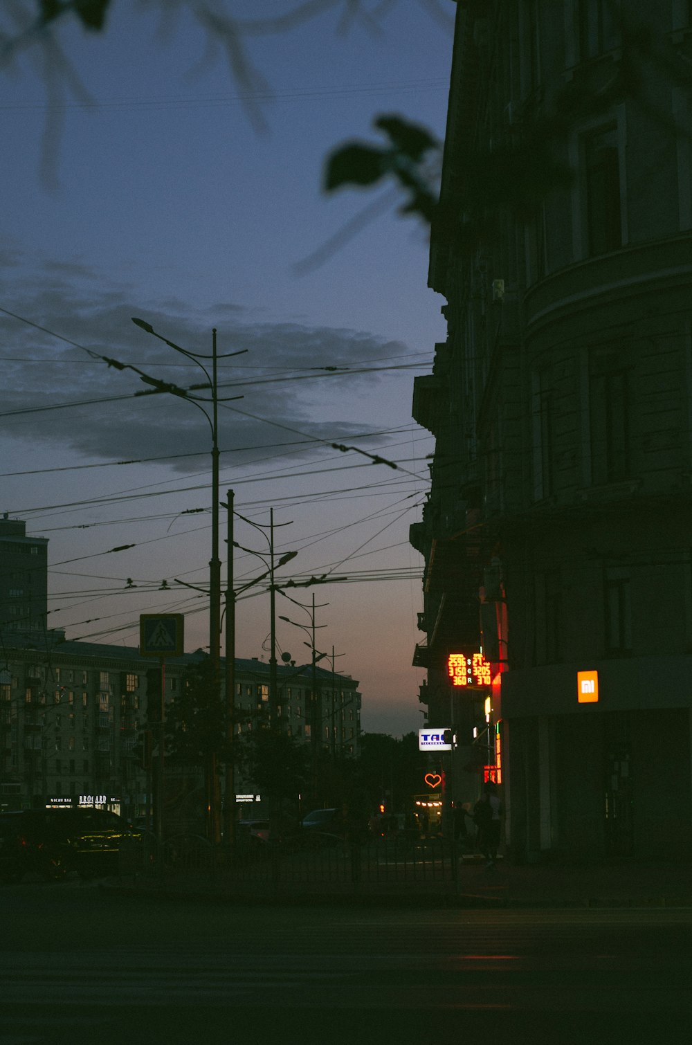 a city street at night with a traffic light