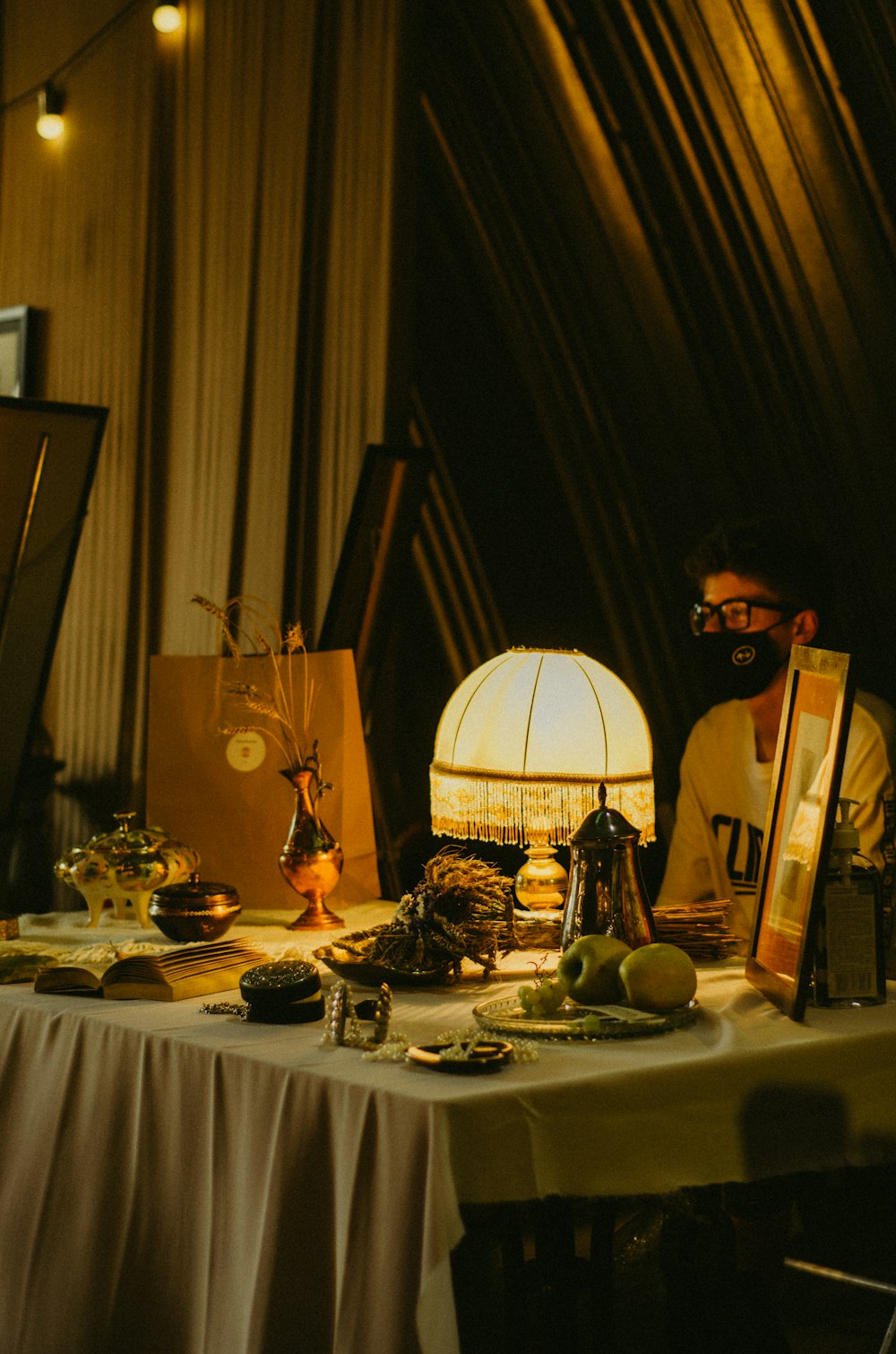 a man sitting at a table with food on it