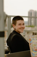 a woman sitting in a chair holding a book