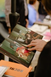 a person holding a book in their hand